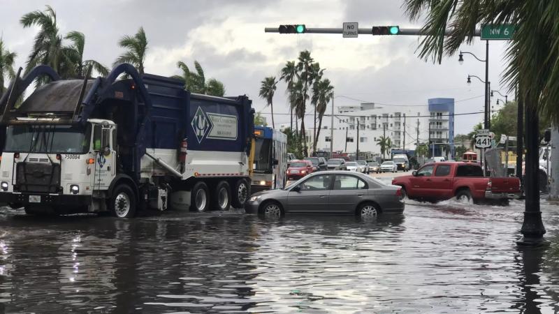 Cars and a garbage truck at the flooded intersection of NW Sixth Street and NW Seventh Avenue in Miami in an undated photo