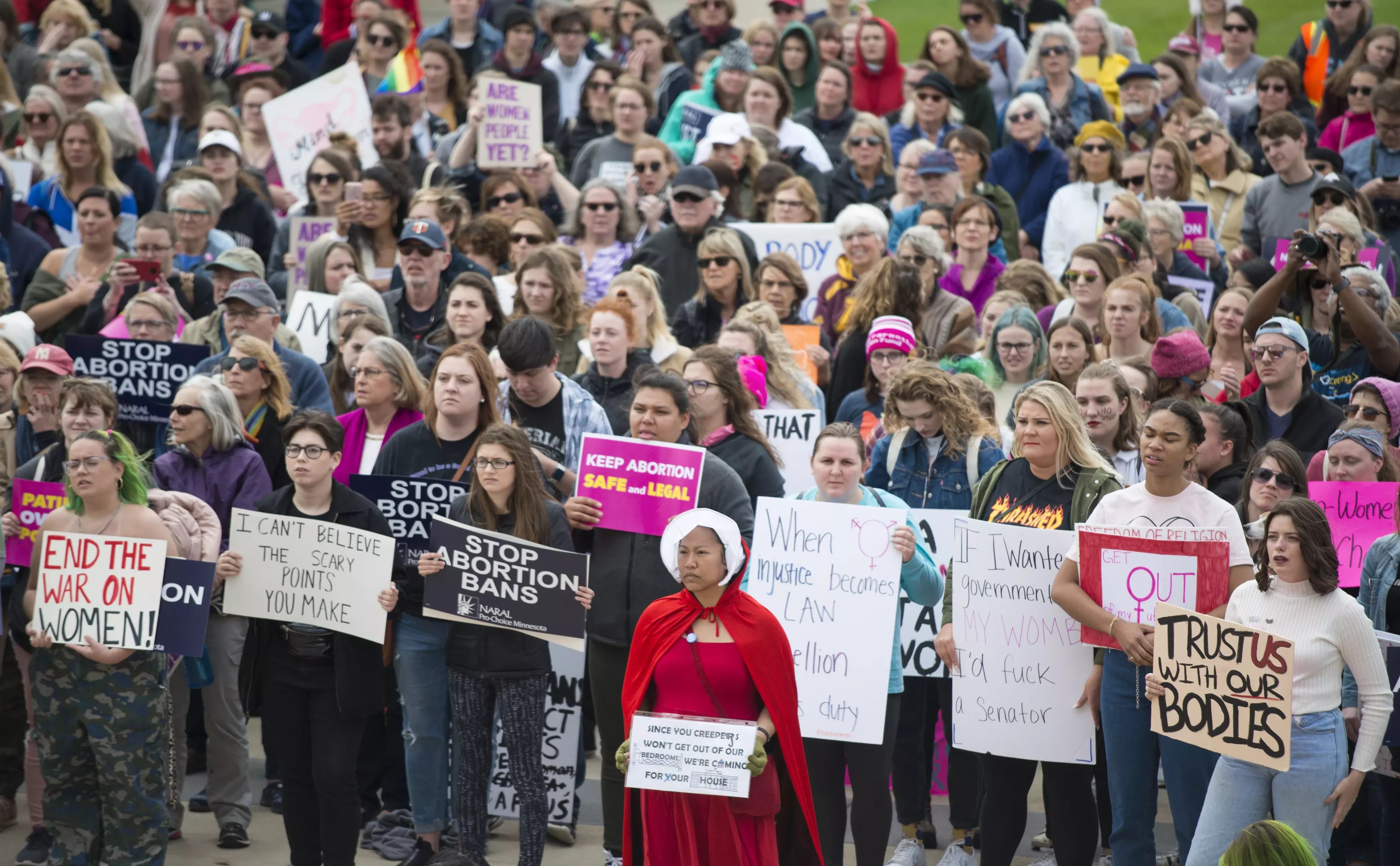 Women protesting and holding signs in favor of abortion rights