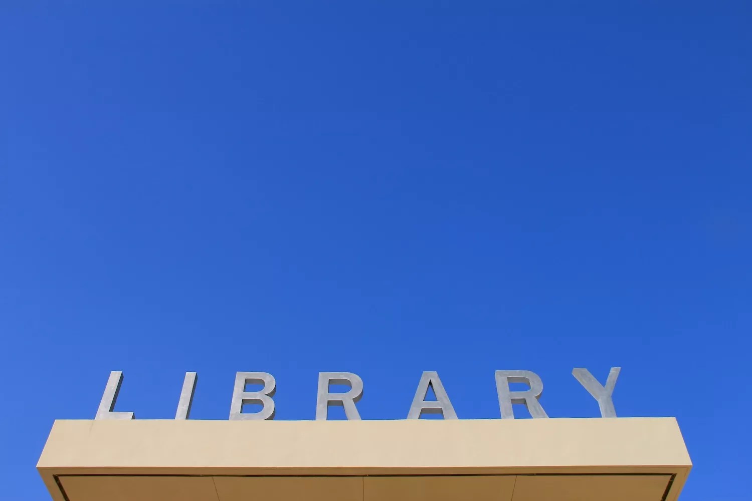 graphically interesting photo of the LIBRARY  sign above the entrance to the Miami Beach Regional Library at 227 22nd St.