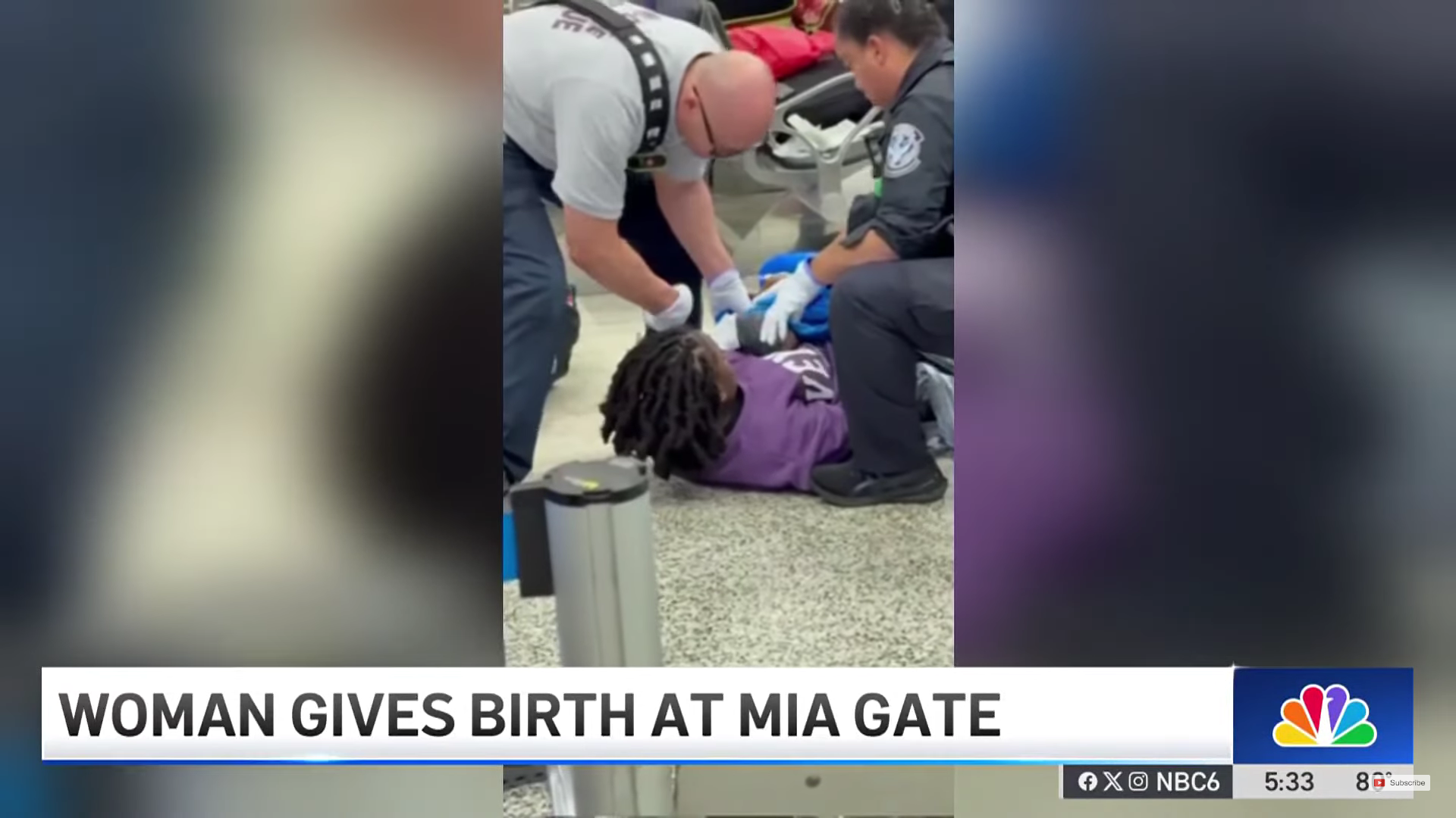 First responders assist a woman lying on the floor of Miami International Airport as she gives birth near Door 3.