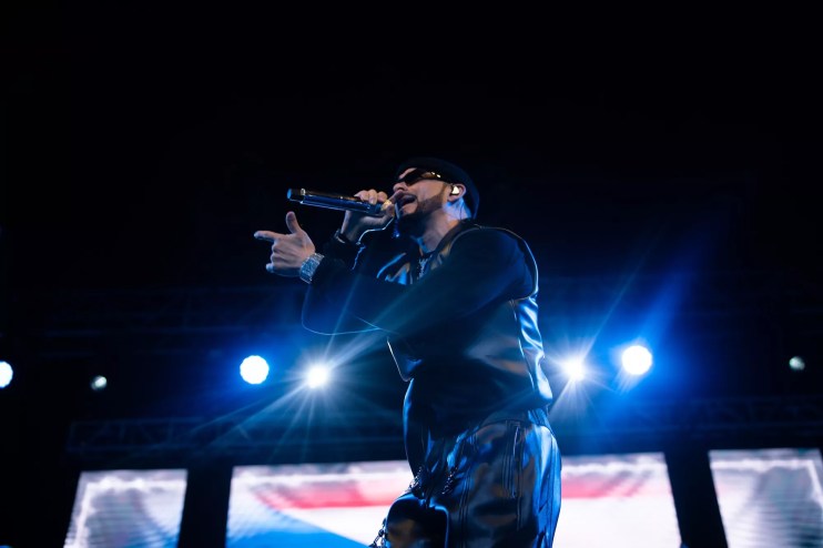 Yandel performing onstage at at the Pérez Art Museum Miami