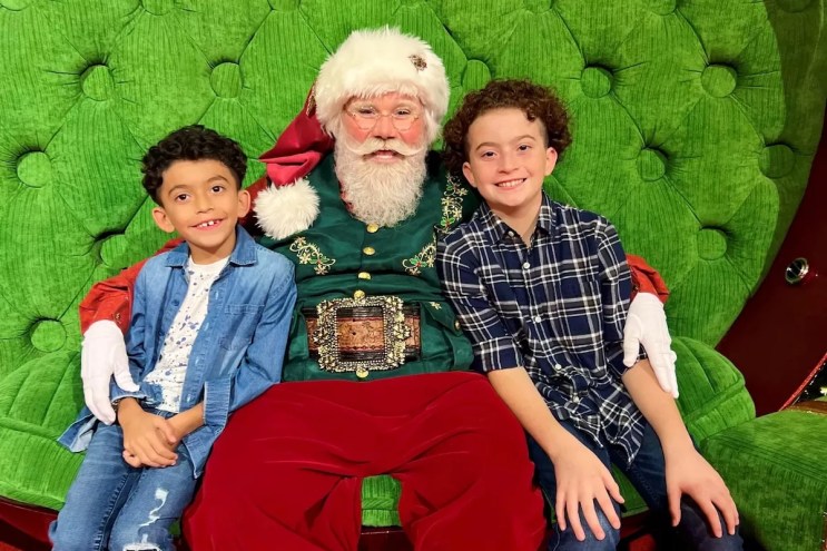 Children posing with Santa Claus at Aventura Mall