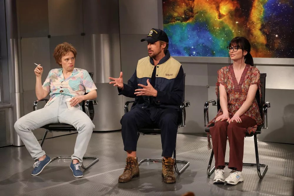 still from Saturday Night Live's "Close Encounter" sketch with Ryan Gosling, Sarah Sherman, and Kate McKinnon