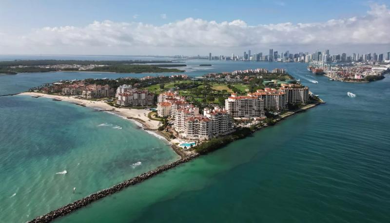 Panorama aerial drone view of Fisher island, with Miami Beach in the background