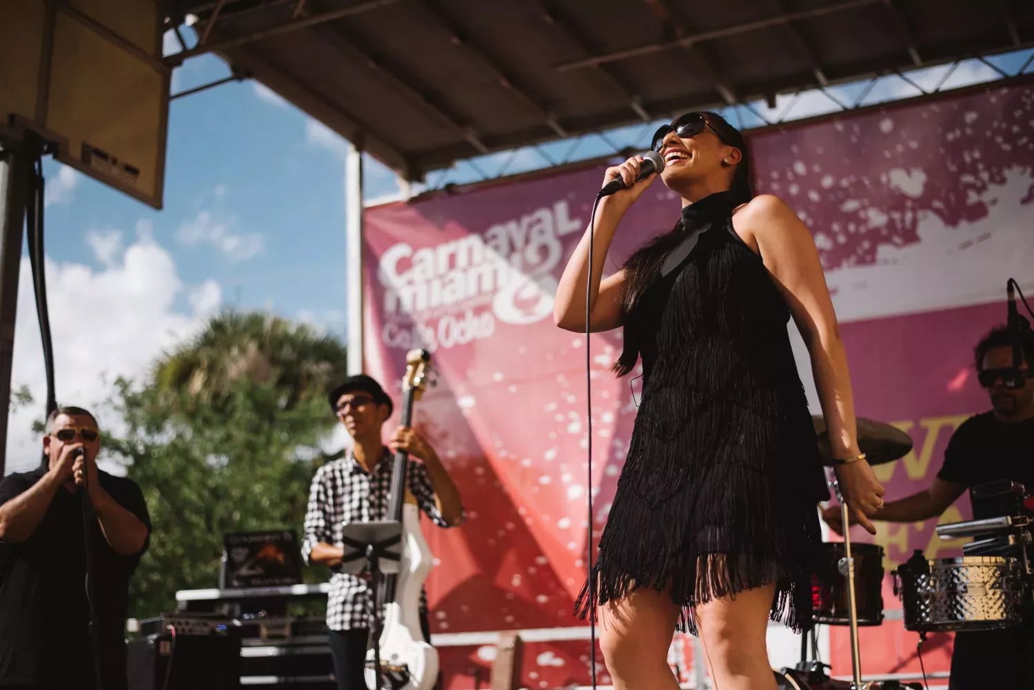 Performer singing on stage at Calle Ocho festival in Miami