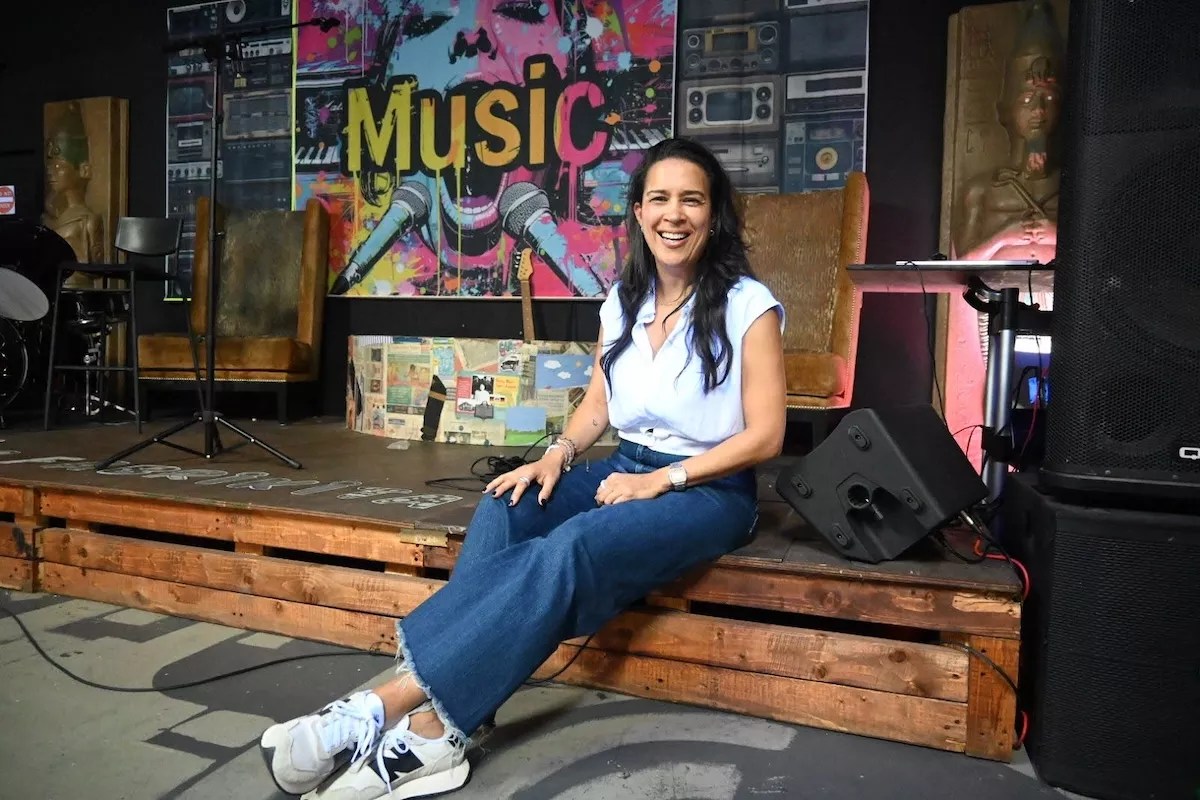 DJ Pati sitting inside La Fabrikita in Miami's Little Havana neighborhood