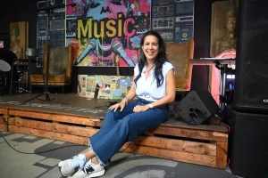 DJ Pati sitting inside La Fabrikita in Miami's Little Havana neighborhood