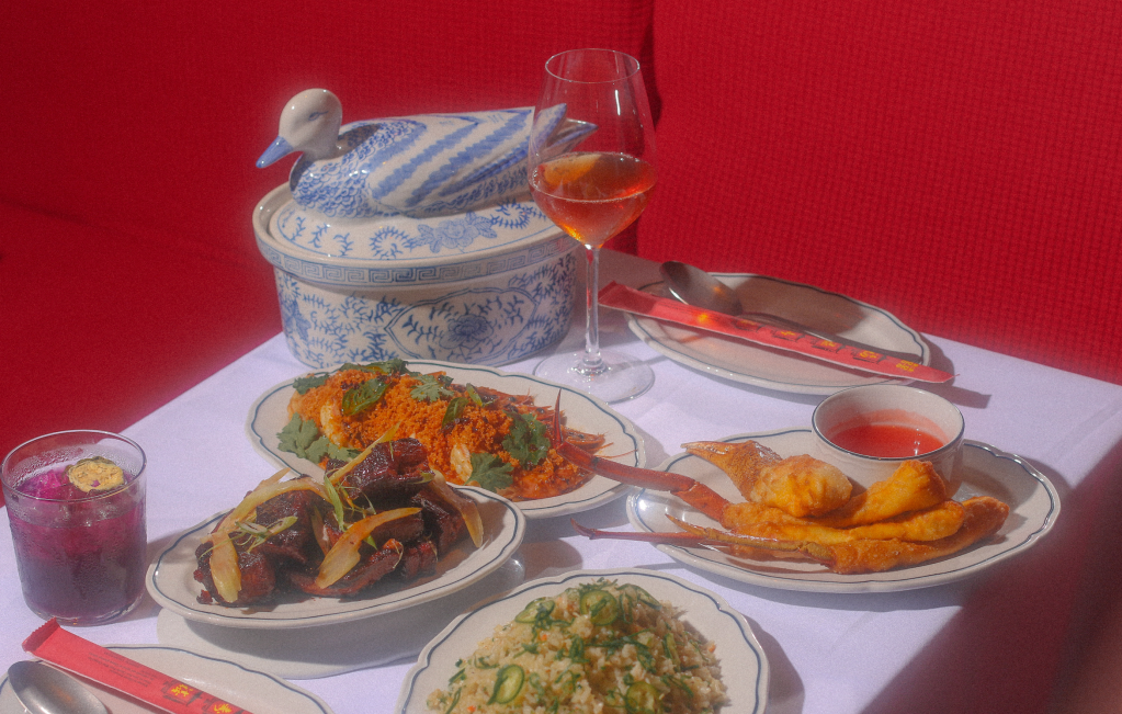 chinese dishes in front of red wall