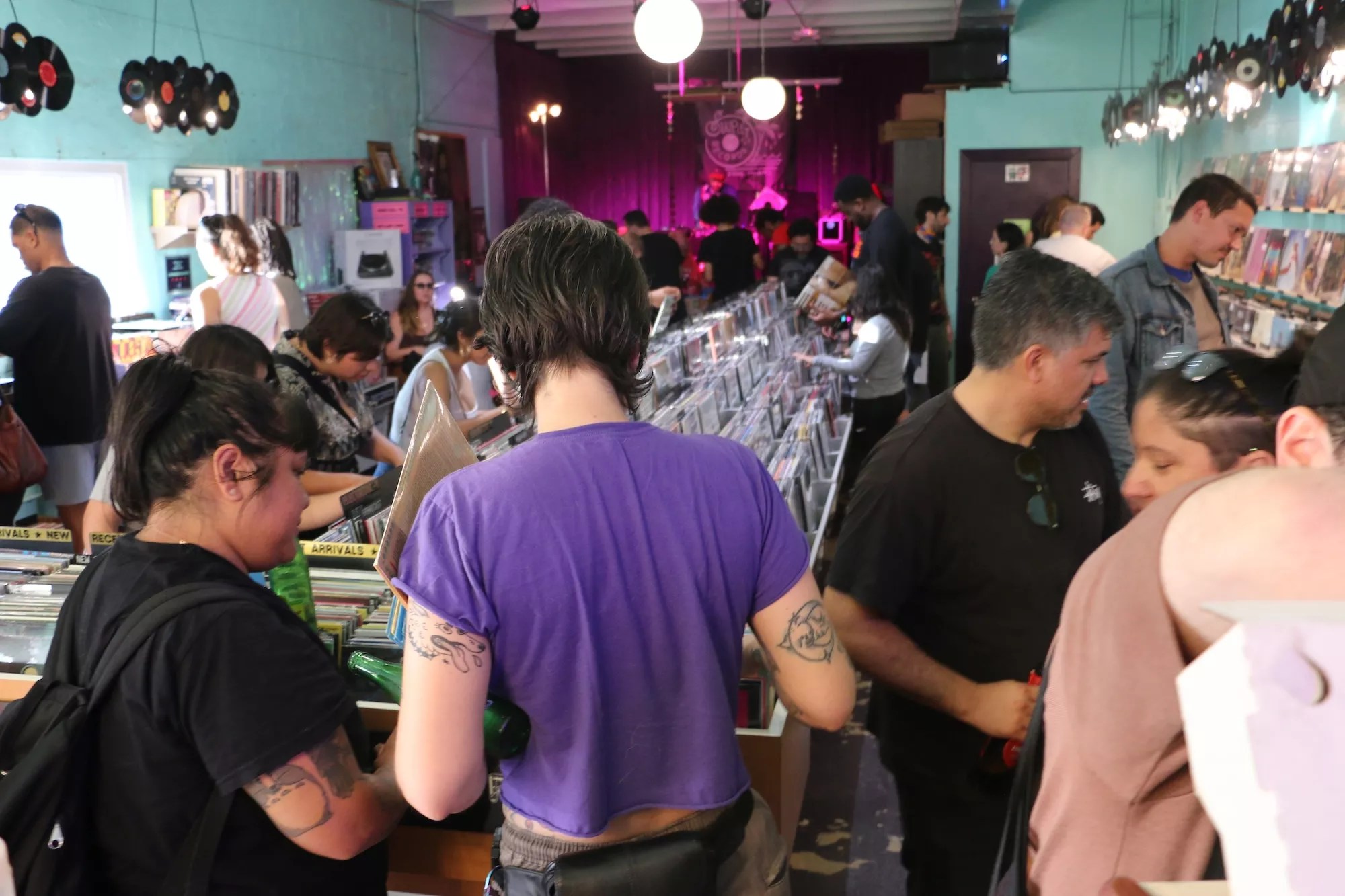 People shopping inside of Sweat Records in Miami