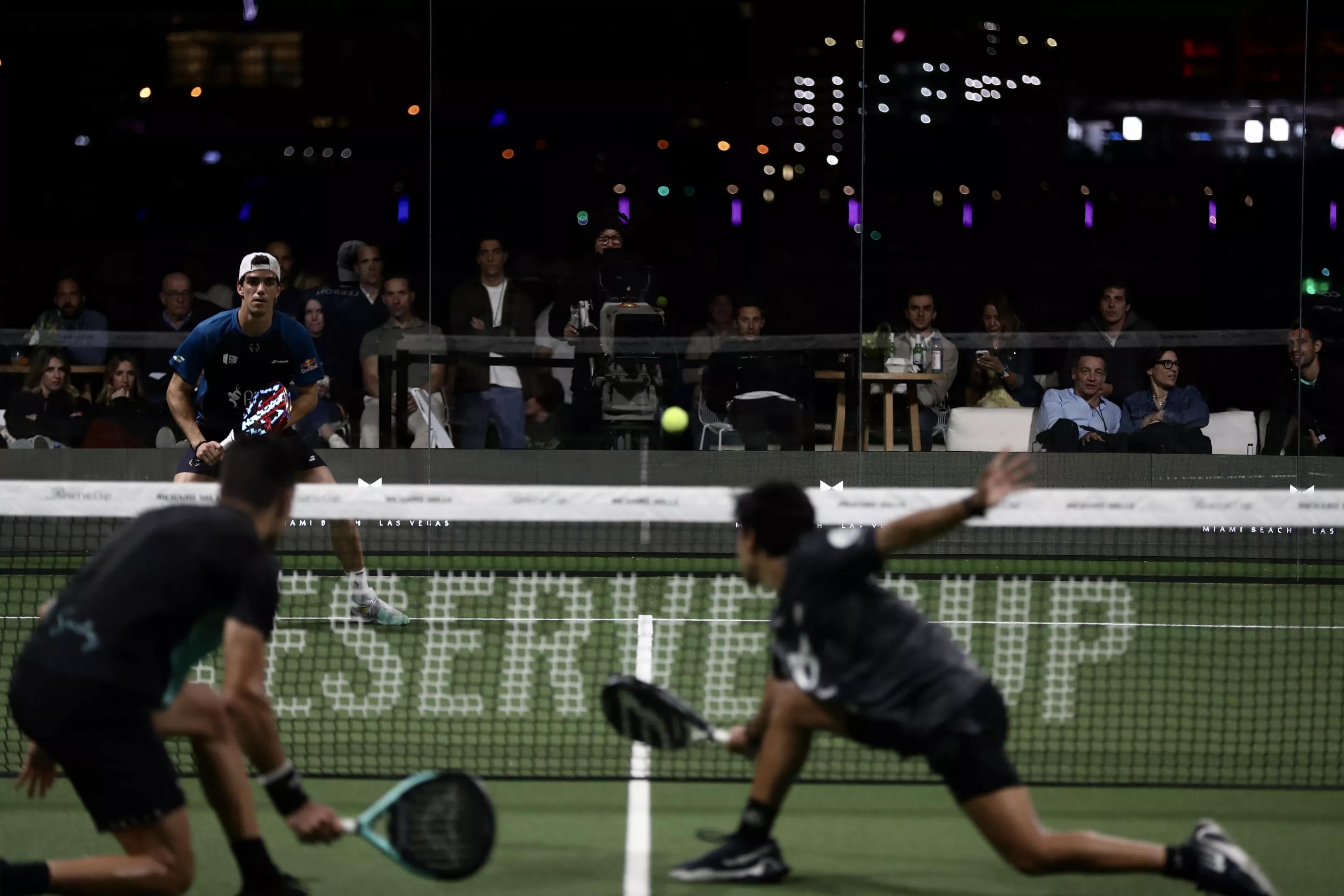 photo of three padel players competing on a court