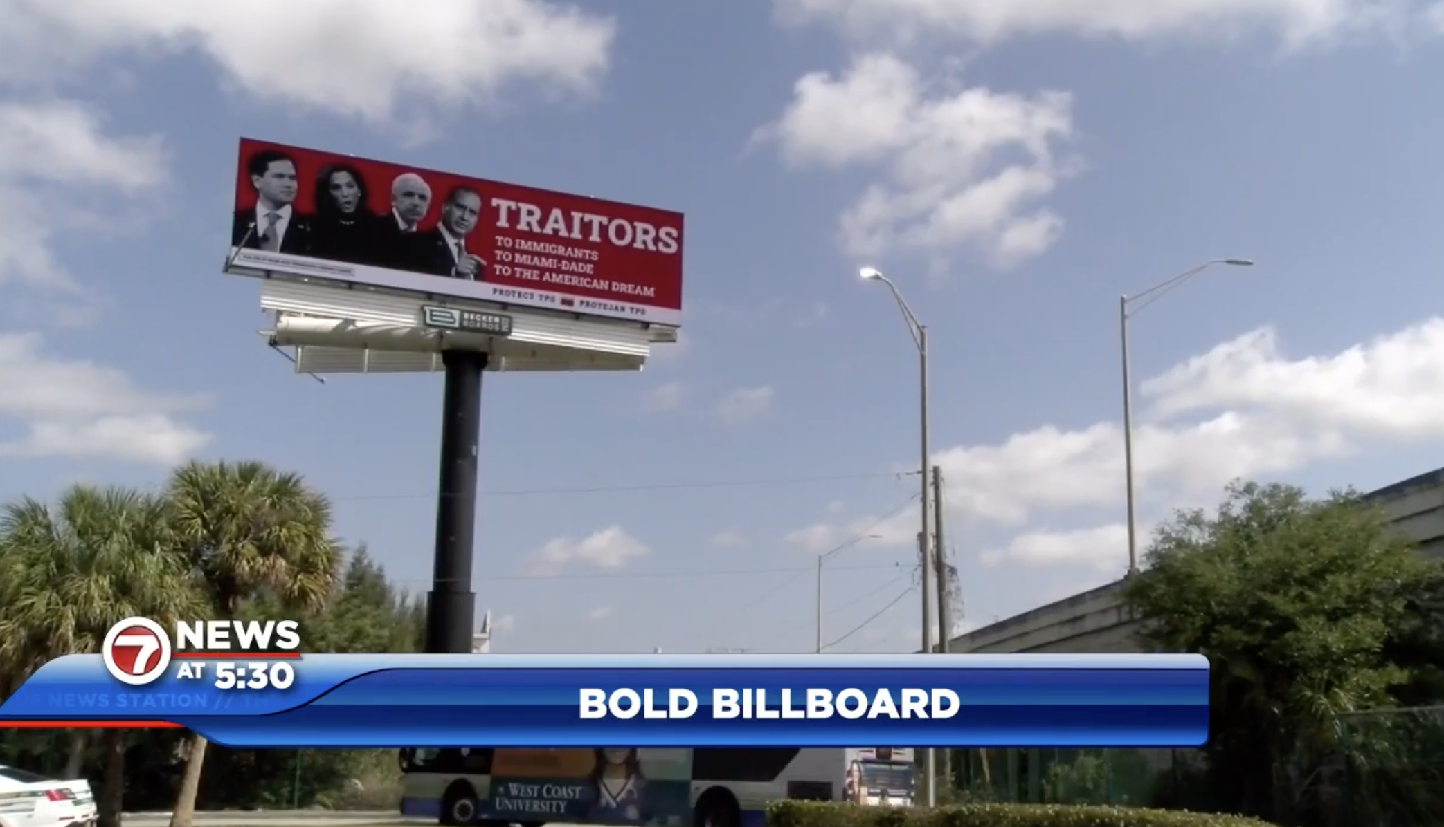 A photo of a red billboard with four politicians on it and the words: “TRAITORS: To Immigrants, To Miami-Dade, To The American Dream” above a blue sky