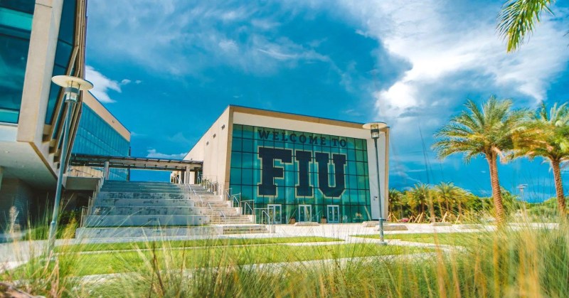 Florida International University glass building with big FIU logo