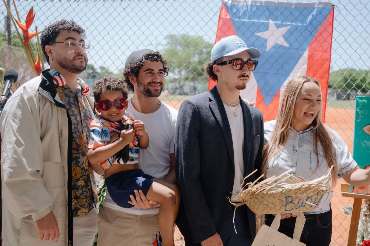 a group of men and a toddler dressed like Bad Bunny