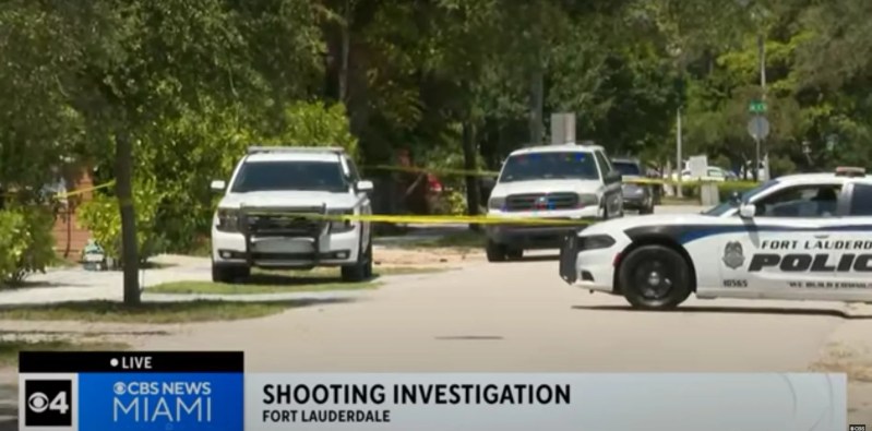 Screenshot of CBS Miami newscast showing Fort Lauderdale Police Department SUVs and caution tape on a street in Fort Lauderdale. The newscast banner reads, "Shooting Investigation Fort Lauderdale."