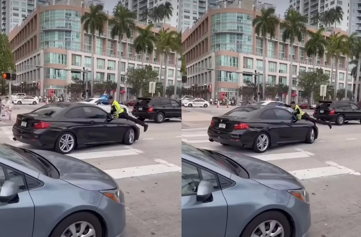 Cell phone video shows a Miami police officer clinging to the hood of a man's car while firing shots through the windshield.