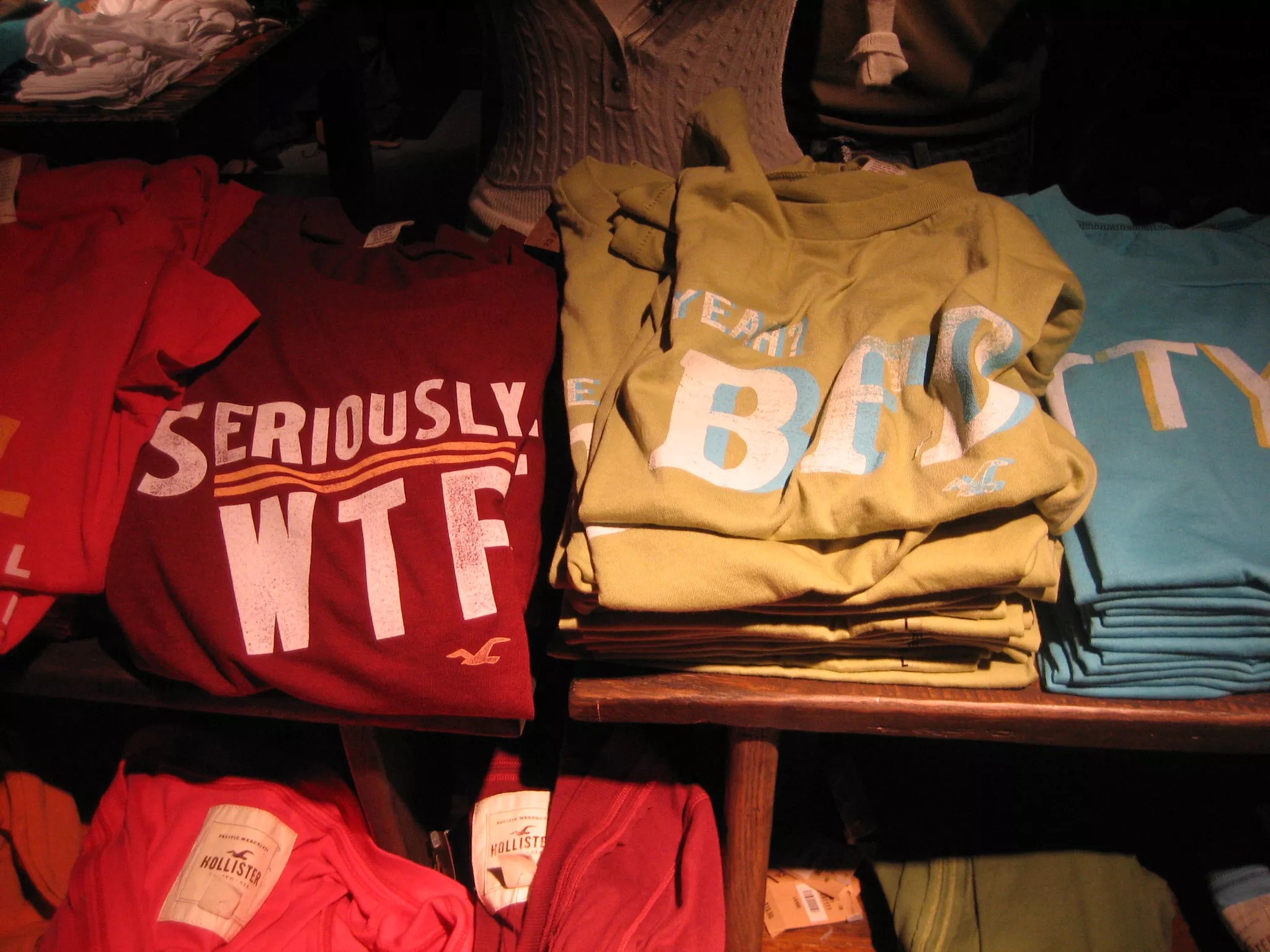 Stacks of T-shirts at a Hollister store.