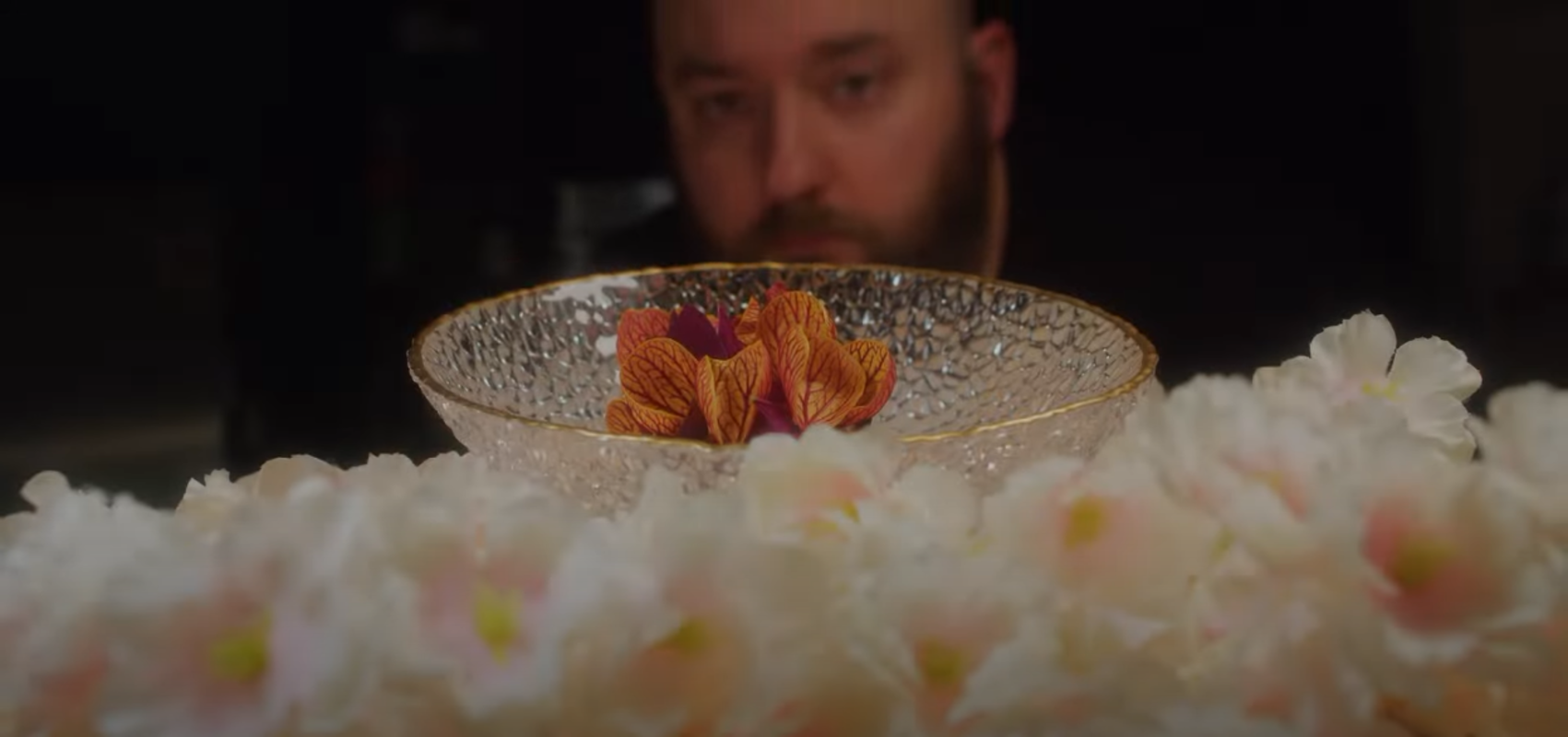 Jacob Bickelhaupt looking at a dish at his restaurant, Konro.