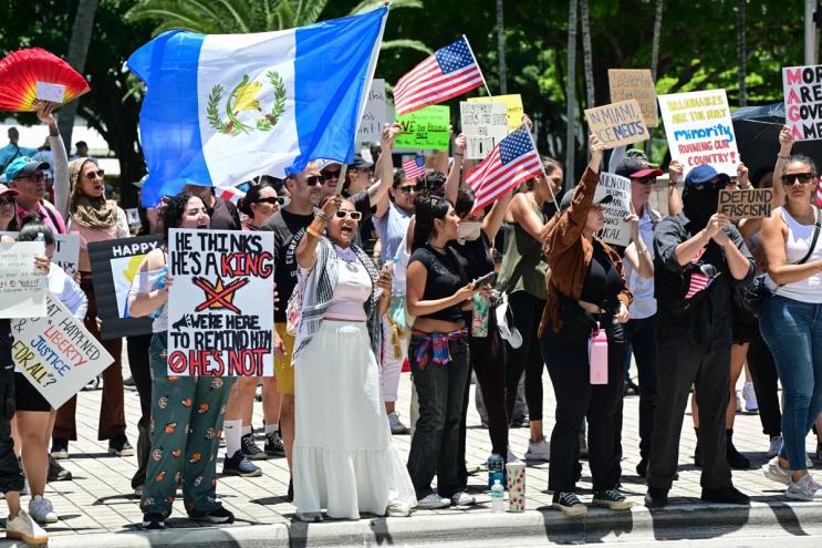 Protesters in Miami rally against President Donald Trump policy decisions.