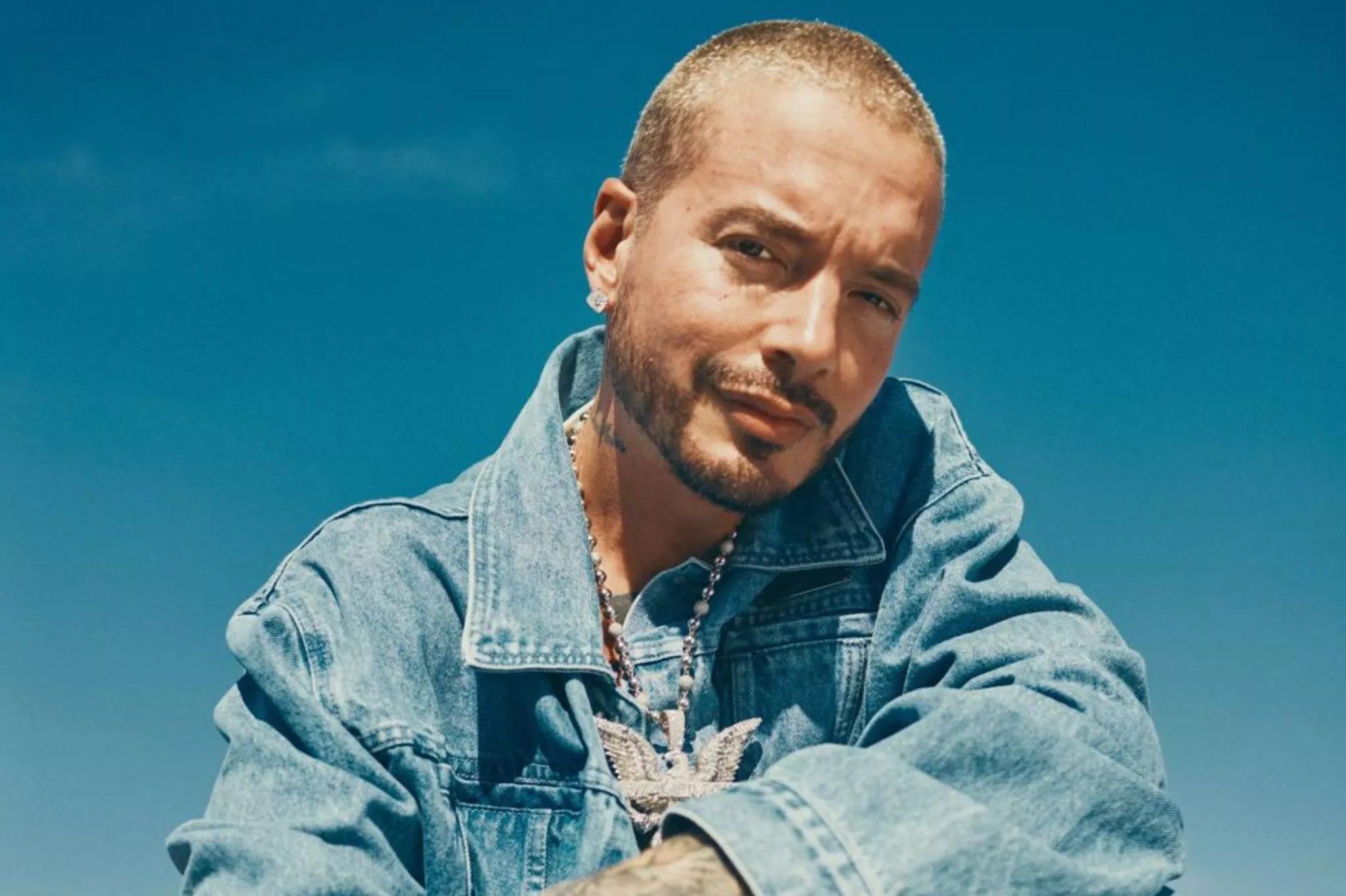 Portrait of a man posing wearing a denim jacket