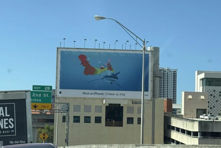 An Apple ad features a phallic-shaped image on I-95 in Miami.