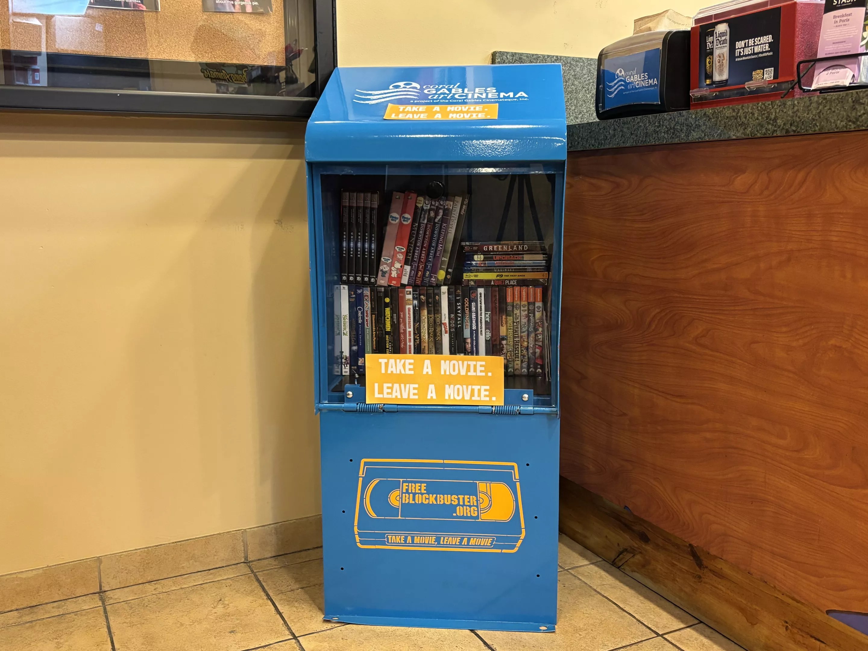 A Free Blockbuster stand inside a movie theater