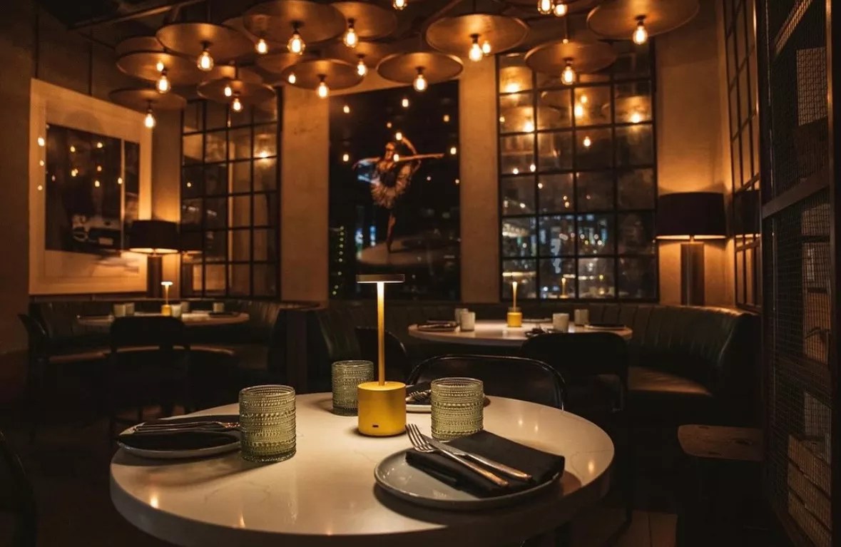 Picture of a table at a restaurant with dim lights.