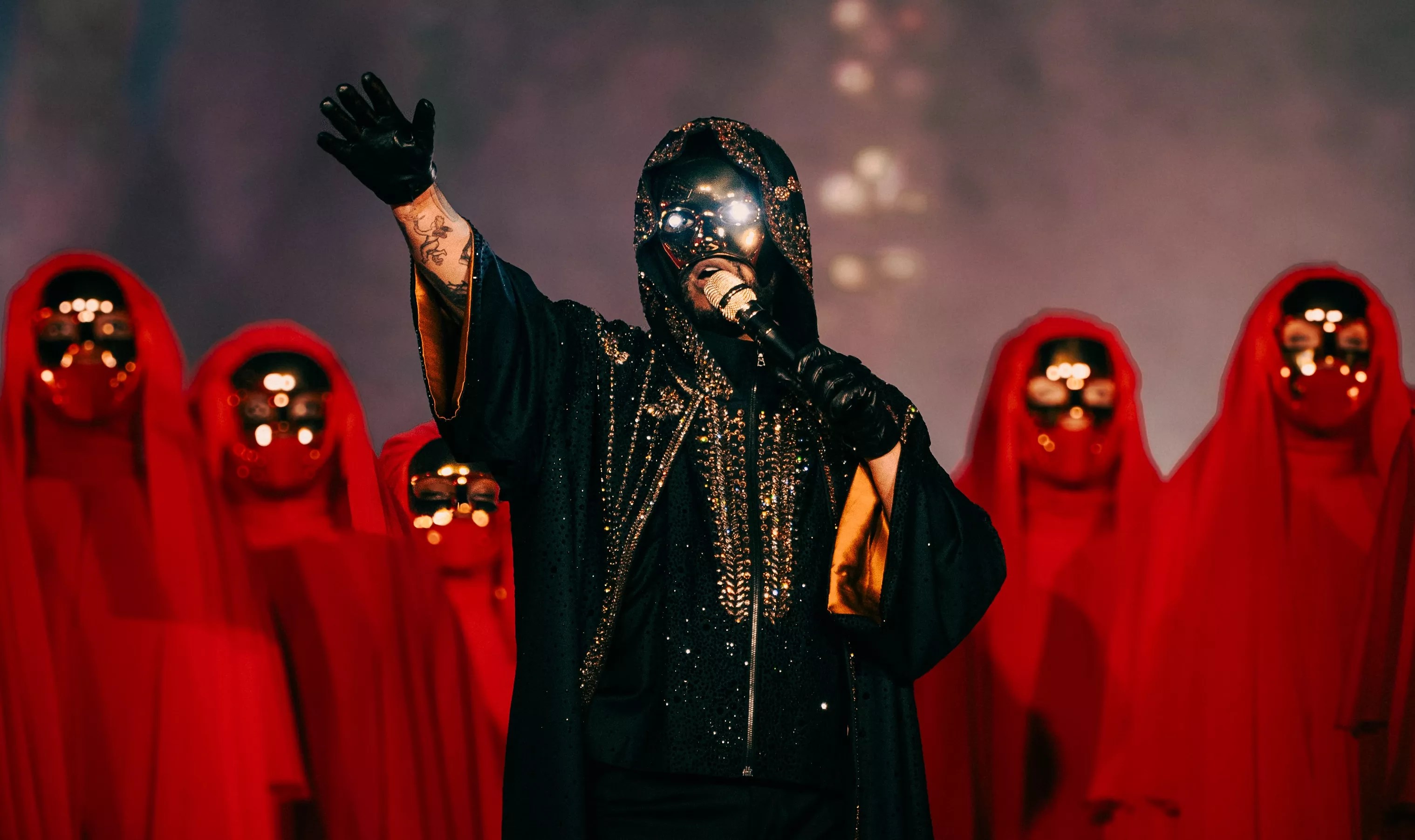 Singer the Weeknd performs in futuristic garb on stage