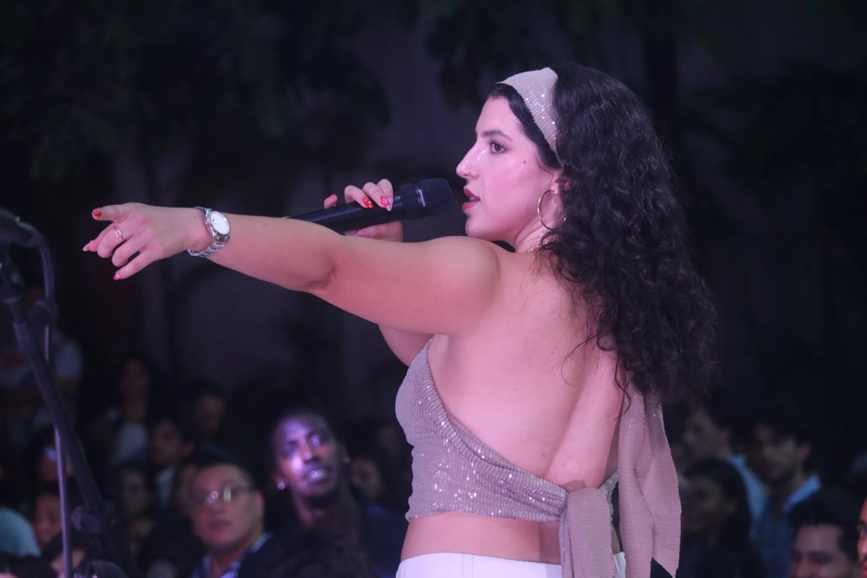 Woman with a bandana and a microphone