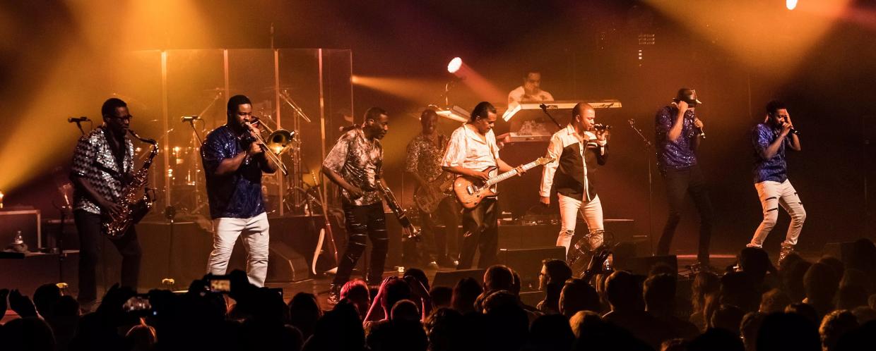 Picture of a band performing on stage.